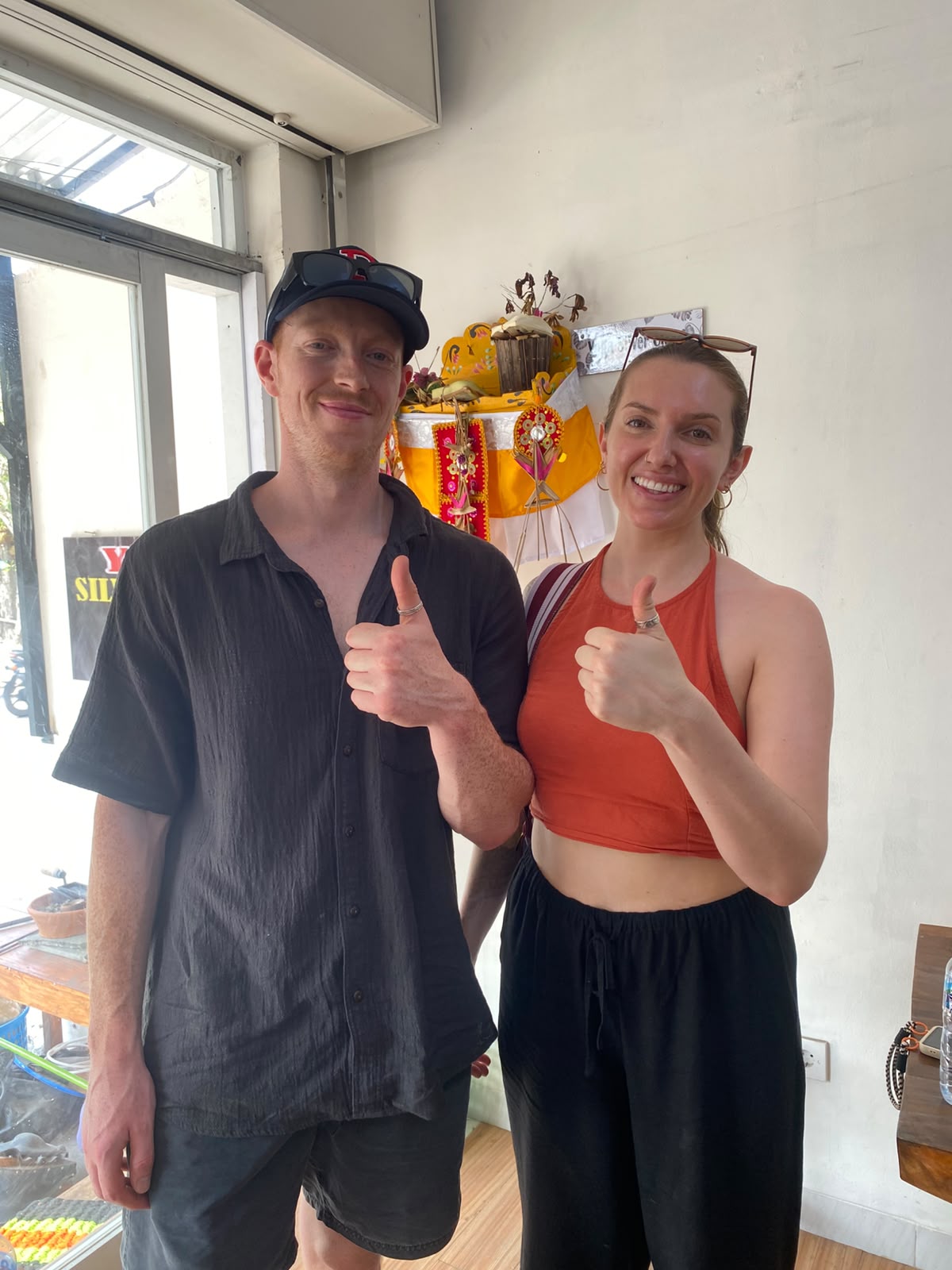 Two participants showing their rings after class