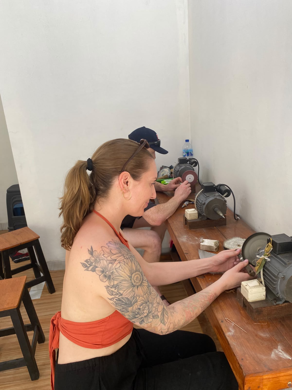 Two participants working at the polishing benches